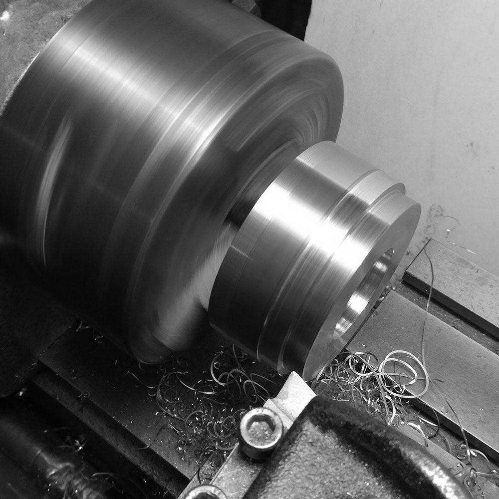 The billet is then turned in order to cut out the rough bezel.