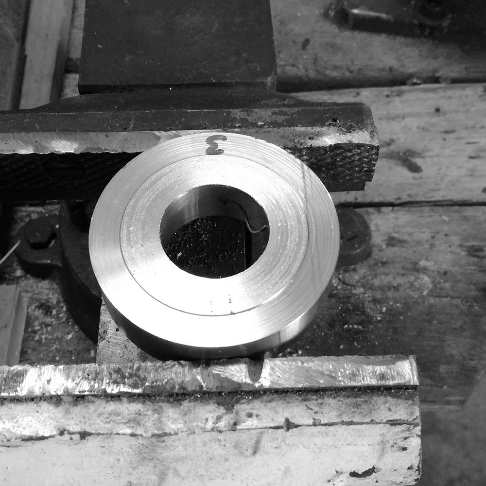 The case body is placed in a vice and sides are rough cut by hand.