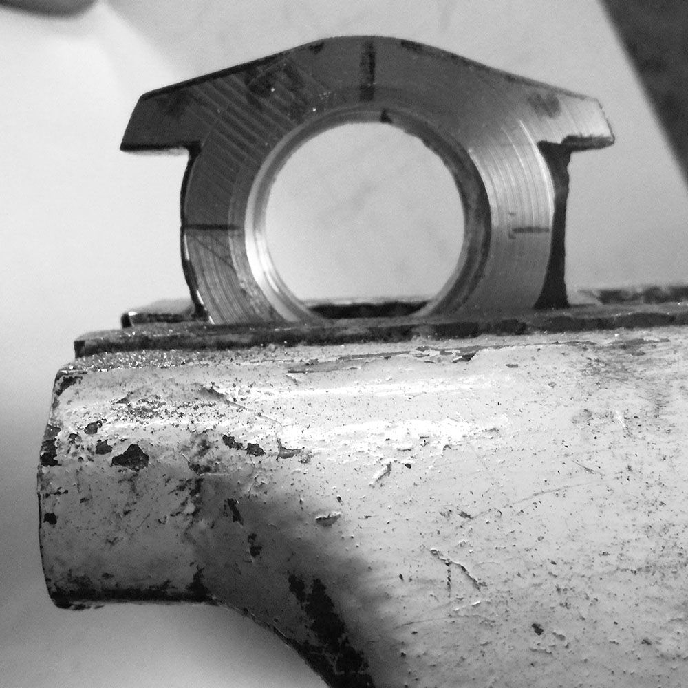 The interior side of the lugs is being filed.
