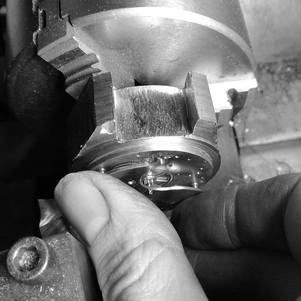 The case was turned around, and the top movement seating given. Here I am checking the micrometer reading with the movement.